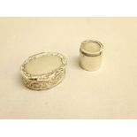 SILVER BOX OF OVAL FORM HAVING EMBOSSED DECORATION TO THE BODY AND AN EMBOSSED BORDER TO THE