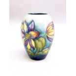 MOORCROFT CLEMATIS PATTERN OVAL VASE, TYPICALLY TUBELINED ON A BLUE/GREEN GROUND (H: 12.5 cm)