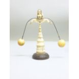 RARE C19th DIEPPE IVORY EROTIC FEMALE FIGURE BALANCE TOY ON CARVED AND DECORATED CONICAL STAND WITH