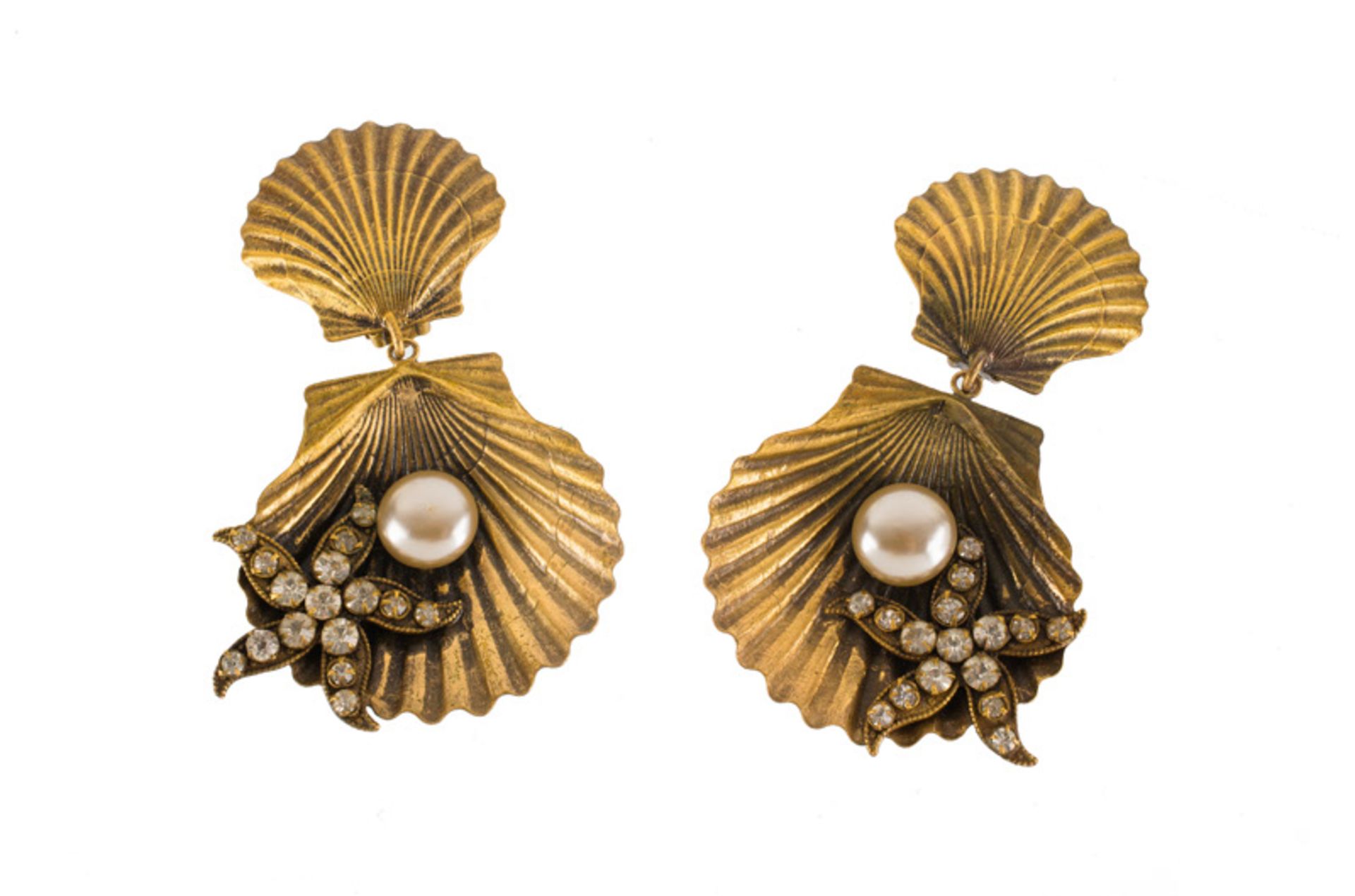 A Joseff Hollywood goldtone pair of earclips, depicting a shell and a starfish, set with rhinestones