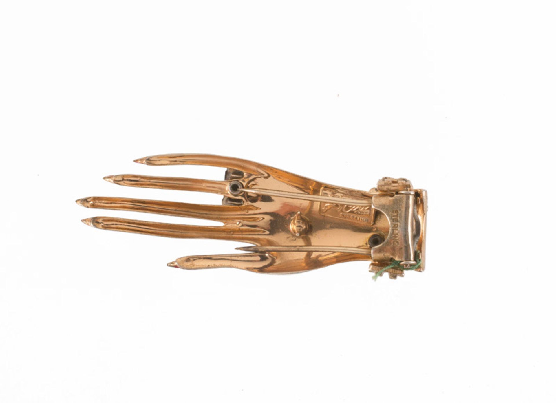 A Coro sterling goldtone brooch in the shape of a hand, wearing a ring. Set with yellow stones, - Image 2 of 3