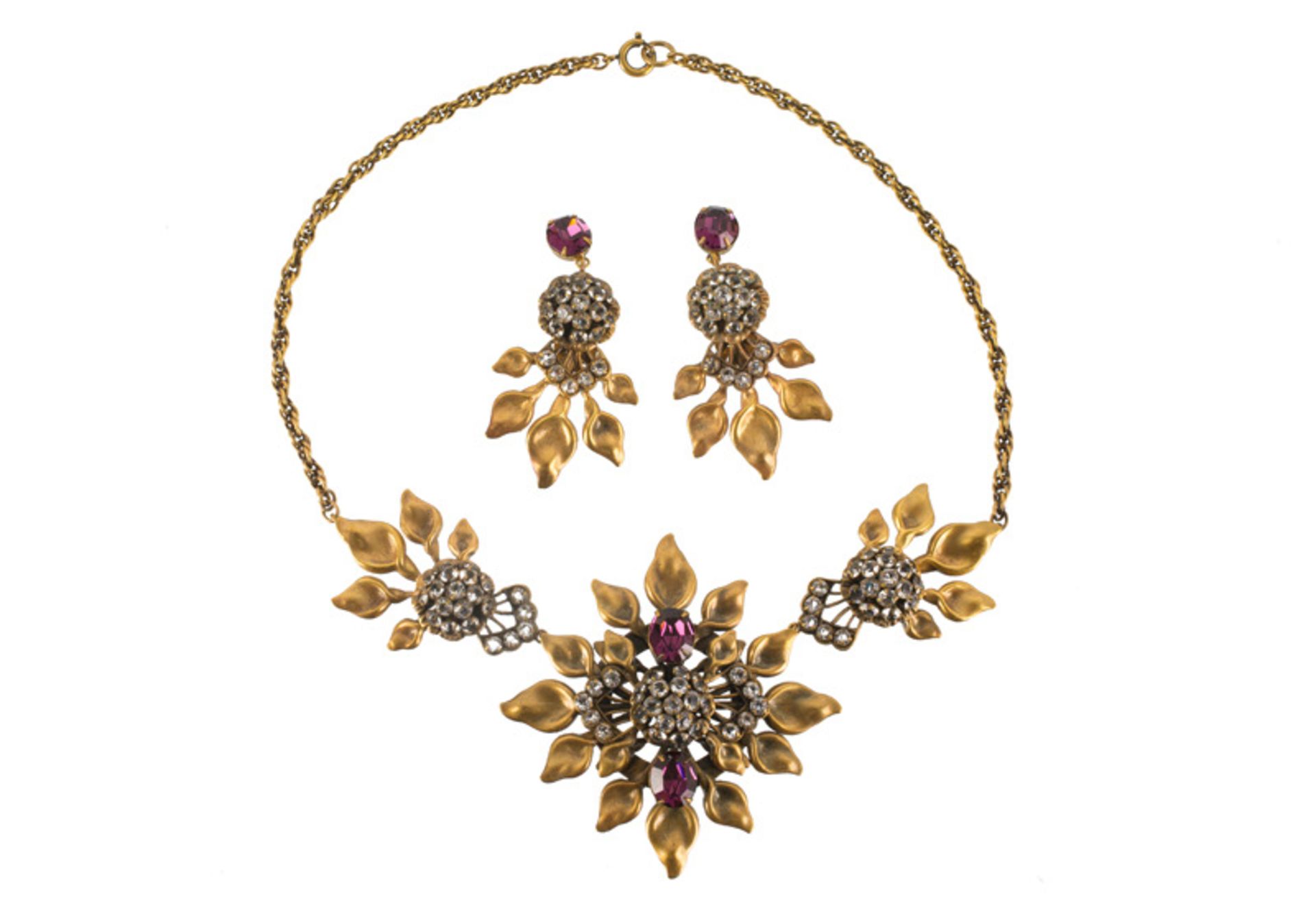 A Joseff Hollywood goldtone necklace and pair of earclips, set with purple stones and rhinestones.