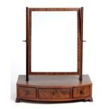 A GEORGE II FLAME MAHOGANY TOILET MIRROR the rectangular plate within a conforming frame suspended