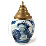 A DUTCH DELFT TOBACCO JAR, DE DRIE KLOKKEN, 19TH CENTURY ovoid, painted with a seated Red Indian