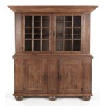 A DUTCH OAK WEDDING DISPLAY CABINET, EARLY 19TH CENTURY the outswept cornice above a pair of