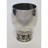 A DANISH SILVER WINE CUP, GEORG JENSEN, 1945-PRESENT the hammered body raised on a circular foot wit