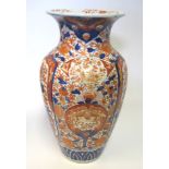 A JAPANESE IMARI VASE, MEIJI, 1868-1912 the tapering ovoid body with everted rim, painted with