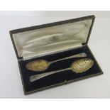 A CASED SET OF TWO GEORGE III SILVER BERRY SPOONS, ON STAMPED HESTER BATEMAN, LONDON, 1777 the other
