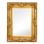 A GILTWOOD MIRROR, 19TH CENTURY the rectangular bevelled plate within a conforming surround,