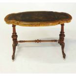 A VICTORIAN WALNUT STRETCHER TABLE the shaped oval top with a gilt-tooled leather-inset writing