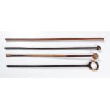 A MISCELLANEOUS COLLECTION OF FOUR ZULU WOODEN STICKS comprising: 2 knobkerries, a walking stick