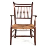 A MAHOGANY SPINDLEBACK ARMCHAIR the curved top rail above a conforming mid- and bottom rail joined