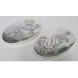 A PAIR OF CHINESE SILVER COVERS, WANG HING & CO each oval body with a dragon, distress, 173g in
