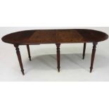 A MAHOGANY EXTENDING DINING TABLE the oval moulded top with hinged drop sides, gadrooned tapering