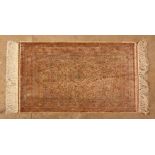 A  HEREKE SILK PRAYER RUG, TURKEY, MODERN the pale orange mehrab with hanging lamp, all with