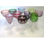 A MISCELLANEOUS GROUP OF COLOURED CUT-GLASS DRINKING GLASSES of various colours and designs (10)
