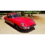 A 1969 JAGUAR E TYPE SERIES II ROADSTER red with black leather interior, right hand drive, wire