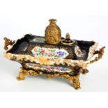 A FRENCH GILT-METAL MOUNTED TWO-HANDLED PORCELAIN INKSTAND, 19TH CENTURY of rectangular outline,