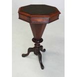 A VICTORIAN WALNUT SEWING TABLE the hinged octagonal top with a gilt-tooled leather-inset surface