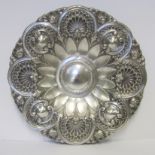 A PORTUGUESE SILVER CHARGER the circular body with flowerhead rim, arches surrounding shells and