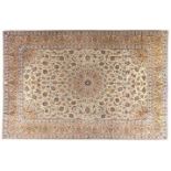 A KESHAN CARPET, PERSIA, MODERN the ivory field with a floral beige medallion and spandrels, all