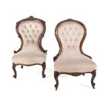 A VICTORIAN WALNUT GRANDMOTHER CHAIR the padded button-back within a conforming frame surmounted