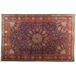 A TABRIZ CARPET, NORTH WEST PERSIA ,MODERN the indigo-blue field with a large ivory floral star