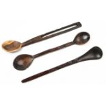 A ZULU WOODEN SPOON the handle pierced and carved with a triangular decoration 35cm long; Another, a