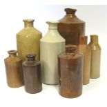 A MISCELLANEOUS GROUP OF EIGHT STONEWARE INK BOTTLES, LATE 19TH CENTURY each of typical