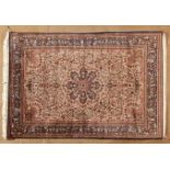 A QUM SILK RUG, PERSIA, MODERN the ivory field with an indigo-blue floral star medallion and