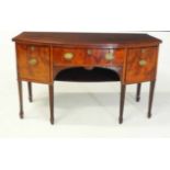 A GEORGE III FLAME MAHOGANY BOWFRONTED SIDEBOARD the shaped rectangular top above a plain frieze,