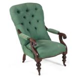 A VICTORIAN MAHOGANY ARMCHAIR the padded back between padded and scrolling arms on curved