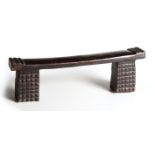 A ZULU HEADREST each support carved with amasumpa decoration 15cm high