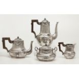 A CONTINENTAL SILVER FOUR-PIECE TEA AND COFFEE SET, .800 STANDARD comprising: a teapot, a coffee