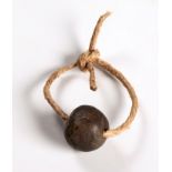 A ZULU BRONZE INDONDO BEAD Often worn by Zulu warriors as a symbol of bravery, these beads were
