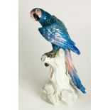A 'MEISSEN' FIGURE OF A BLUE PARROT, 20TH CENTURY Meissen model number 77234, perched on a tree