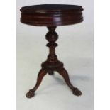A WILLIAM IV MAHOGANY WORK TABLE the hinged moulded circular top above a moulded frieze on a
