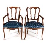 A PAIR OF FRENCH WALNUT ARMCHAIRS, 19TH CENTURY each shaped carved reeded and pierced back between