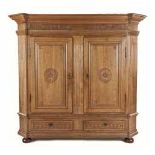 A DUTCH OAK CUPBOARD, 19TH CENTURY the moulded outswept top with canted corners above a frieze