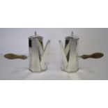 A PAIR OF ELECTROPLATE CHOCOLATE POTS each octagonal body with roped rim, applied with a turned-