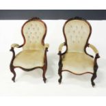 A PAIR OF VICTORIAN MAHOGANY ARMCHAIRS each padded button-back within a conforming frame centred