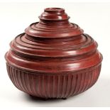 A BURMESE RED LACQUERED HSUN-OK OFFERING BOWL, 19TH CENTURY circular, the fluted bowl with stacked