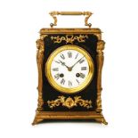 A FRENCH TABLE CLOCK the 9cm white enamelled circular dial with a gilt chapter ring, Roman numerals,