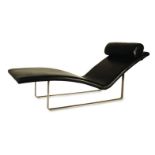 A SIMPLICITY CHAISE LONGUE DESIGNED BY HALDANE MARTIN with adjustable headrest, upholstered in black