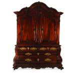 A DUTCH FLAME MAHOGANY ARMOIRE, 19TH CENTURY in two parts, the moulded and gabled pediment centred