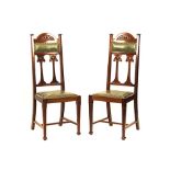 A SET OF SIX SCOTTISH MAHOGANY ART NOUVEAU DINING CHAIRS each foliate-carved back rail above two