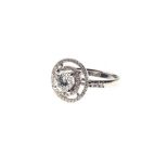 A DIAMOND RING centred with a claw-set round brilliant-cut diamond weighing 1.1cts, within a