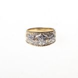 A DIAMOND RING of floral design embellished with diamonds weighing approximately 0.50ct in total,