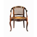 A CAPE STINKWOOD TUB CHAIR, 19TH CENTURY the caned back within a conforming frame inscribed C.E.A.