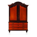 A CAPE STINKWOOD AND YELLOWWOOD ARMOIRE, 19TH CENTURY the gabled pediment above two panelled doors
